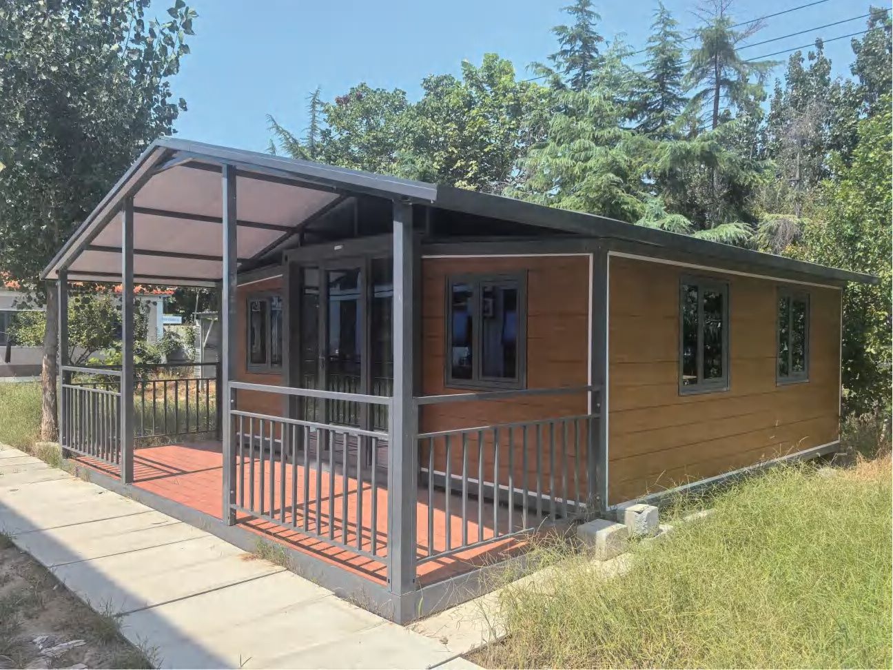 Double-wing expandable house installed outdoors with porch